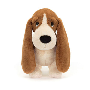 Super-soft snuggles guaranteed: This frontal view of Jellycat's Randall Basset Hound highlights his adorable face, toffee fur, and cuddly form.