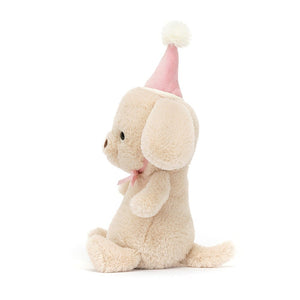 Side View:  Cuddles & naps! The Jellycat Jollipop Puppy boasts soft honeycomb fur, a stylish party hat, floppy ears, and a wagging tail. 