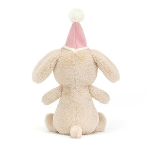 Behind View:  Don't miss the tail wags! The Jellycat Jollipop Puppy has luxuriously soft fur, a festive pink hat, and a cute little tail.