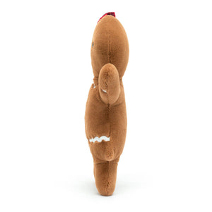 Side view of Jellycat Jolly Gingerbread Ruby Original showing plush brown texture and white icing trim.