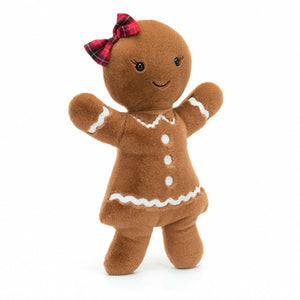 Angled: Jellycat Jolly Gingerbread plush (angled view): Gingerbread cookie plush with red tartan bow, embroidered lashes & raised biscuit arms.