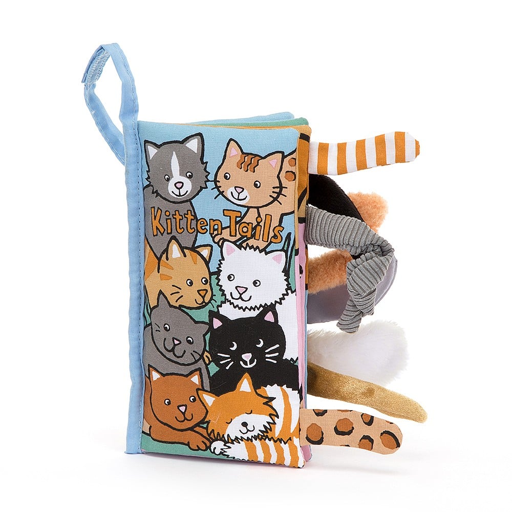 Jellycat Kitten Tails Activity Book standing tall, revealing a colorful spread with adorable cats boasting stripes, spots, and lots of tails.