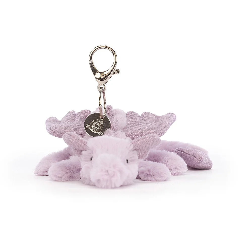 Lavender Dragon Bag Charm with plush lavender fur and sparkles on the tail ears and spine. With a silver clip and jellycat tag.