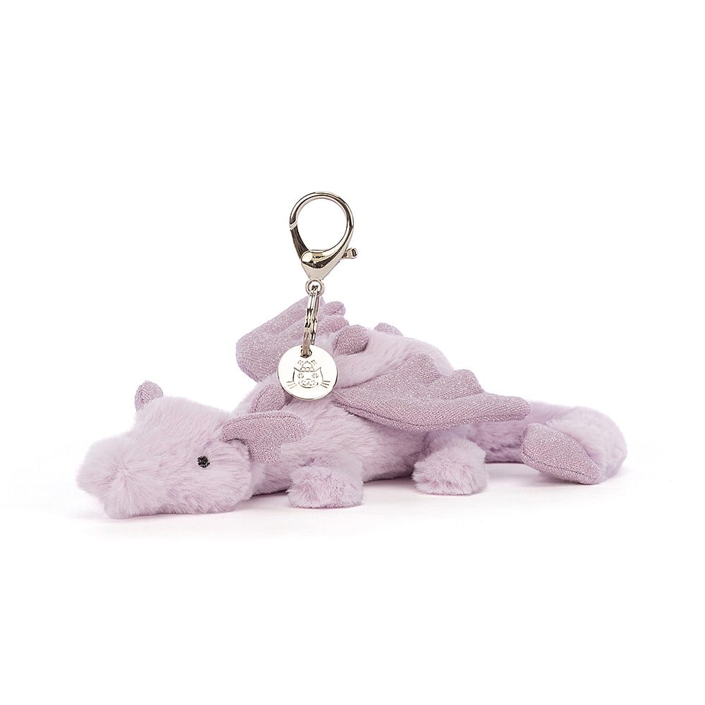 Lavender Dragon Bag Charm with plush lavender fur and sparkles on the tail ears and spine. With a silver clip and jellycat tag.