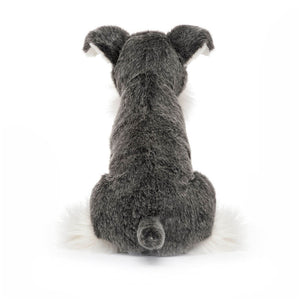 Back view of Jellycat Lawrence Schnauzer plush toy highlighting its soft, textured fur and cute tail.