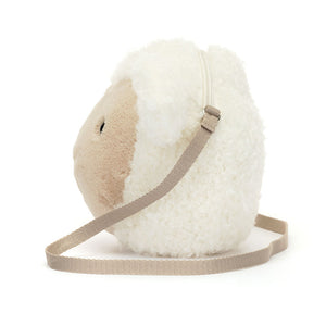 Side view of Jellycat Little Lamb Bag, displaying its cuddly body and soft, plush texture.
