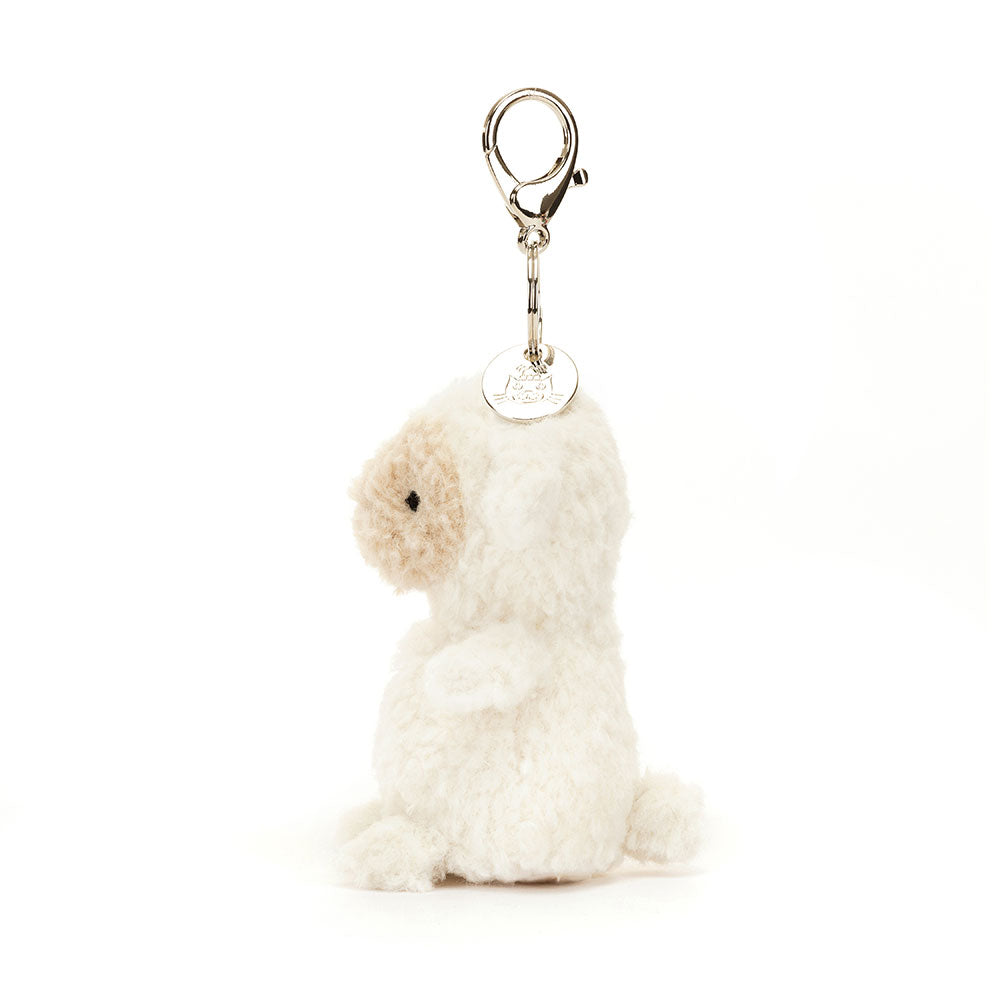 Side view of Jellycat Little Lamb Bag Charm, showing its compact size and cuddly appearance.