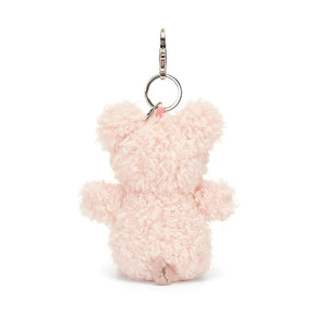 A rear view of Jellycat Little Pig Bag Charm showing the silver bag clip.