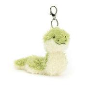 Jellycat Little Snake Bag Charm, angled view, showing its soft green and cream fur and silver claw clip and Jellycat tag to attach to any bag.