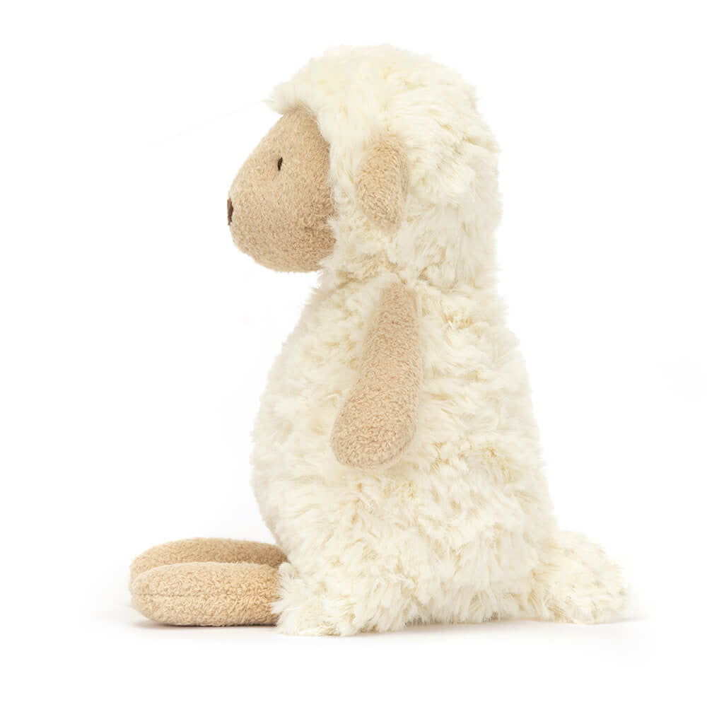 Side view – Profile of Jellycat Lollie Lamb, showing her fluffy texture and gentle expression.