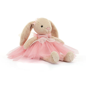 Jellycat Lottie Bunny Fairy wearing a pink satin bodice, three layered mesh tutu with a petal peplum and little pink ribbons on the ears.