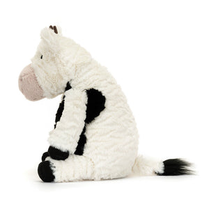 Side profile of Jellycat Mooliet Cow, highlighting its plush fabric and adorable details.