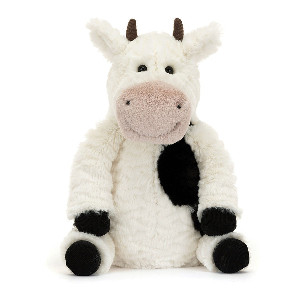 Close-up of Jellycat Mooliet Cow’s face, showing its friendly eyes and soft pink snout.