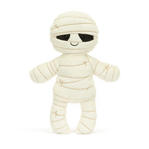 Straight: Huggable Jellycat Mummy Bob plush (front view) with black eyes and cream fur bandages.