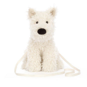 Front: Calling all dog lovers! The Jellycat Munro Scottie Dog Bag is a charming companion made from luxuriously soft plush. Featuring a Scottie dog silhouette and a touch of whimsy, it's the perfect way to carry your essentials with a smile.