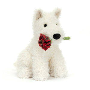 Angled View: Jellycat Munro Scottie Dog 'Love You', a shaggy cream Scottie with a red rose.