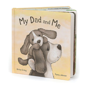 Angled View: Unwrap a heartwarming story! The Jellycat My Dad and Me Book features a colorful cover with a puppy and dad silhouette, inviting a cozy cuddle 