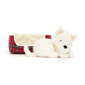 Straight On View: Jellycat Napping Nipper Westie resting peacefully, outside the cozy quilted tartan bed.