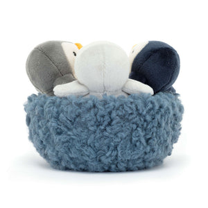 Back View: Cosy nest comfort! The Jellycat Nesting Penguins with a mossy blue nest, perfect for cuddles and play.