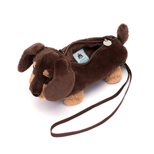 Bag unzipped view:  Ditch the leash, grab the Otto Sausage Dog Bag! This adorable Jellycat crossbody bag boasts a spacious interior, secure zip, and cute biscuit-colored details.