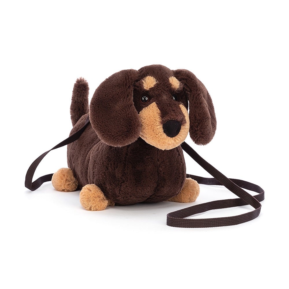 Angled view: Carry your essentials in style with the Jellycat Otto Sausage Dog Bag! This crossbody bag features a playful design.