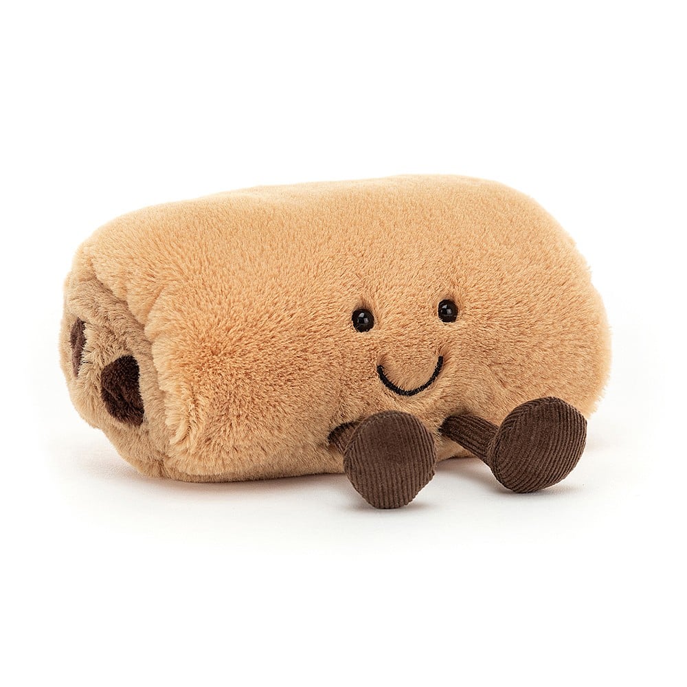 Angled view:  Don't resist the pastry cravings! Amuseable Pain Au Chocolat by Jellycat features layers of soft fur, chunky suedey chocolate, and cute cordy boots.