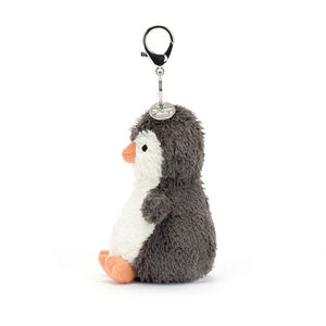 Side View: Clip-on cuteness! Jellycat Peanut Penguin Bag Charm (17 cm tall). This plush penguin keychain boasts soft fur, adorable details, and is the perfect bag accessory.