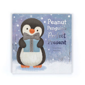 Hardback Jellycat Peanut Penguin’s Perfect Present book with illustrated penguin holding a gift on a snowy blue cover.