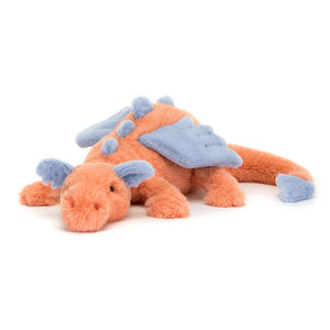 Angled View: Sunshine scales! The Jellycat Persimmon Dragon stretches out, showcasing its vibrant coral fur with delicate stitching. Indigo wings, ears, spines & tail dart add a pop of colour. A cuddly friend for any adventure!