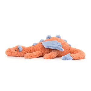 Side View: Side profile of the cuddly Jellycat Persimmon Dragon. Highlights the perfect size for cuddling (suitable from birth), the soft, huggable plush material, and the vibrant contrast between the coral body and the indigo wings and tail. 