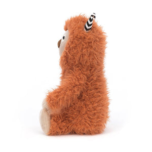 Side View: Pip Monster leaves a trail of adorable wherever he goes! This cuddly Jellycat plush features soft ginger fur, humbug horns, and a giant suedey truffle nose, perfect for sniffing out fun.