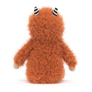 Back View: Pip Monster leaves a trail of adorable wherever he goes! This cuddly Jellycat plush features soft ginger fur and humbug horns.