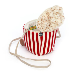 Peek inside the delightful Jellycat Popcorn Bag! Discover a spacious interior filled with soft, fluffy popcorn pieces, ready for cuddles and adventures.