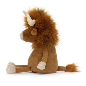 Side View:  Spark your child's love for farm animals with Jellycat Ramone Bull!  This 33 cm plush boasts soft fur, adorable details like a tassel tail, and is a cuddly friend for playtime or bedtime.