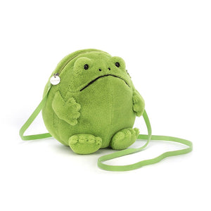 Angled view: Adventure awaits! The Ricky Rain Frog Bag by Jellycat features a plump, mossy body, bright green lining, and a comfy webbed strap.