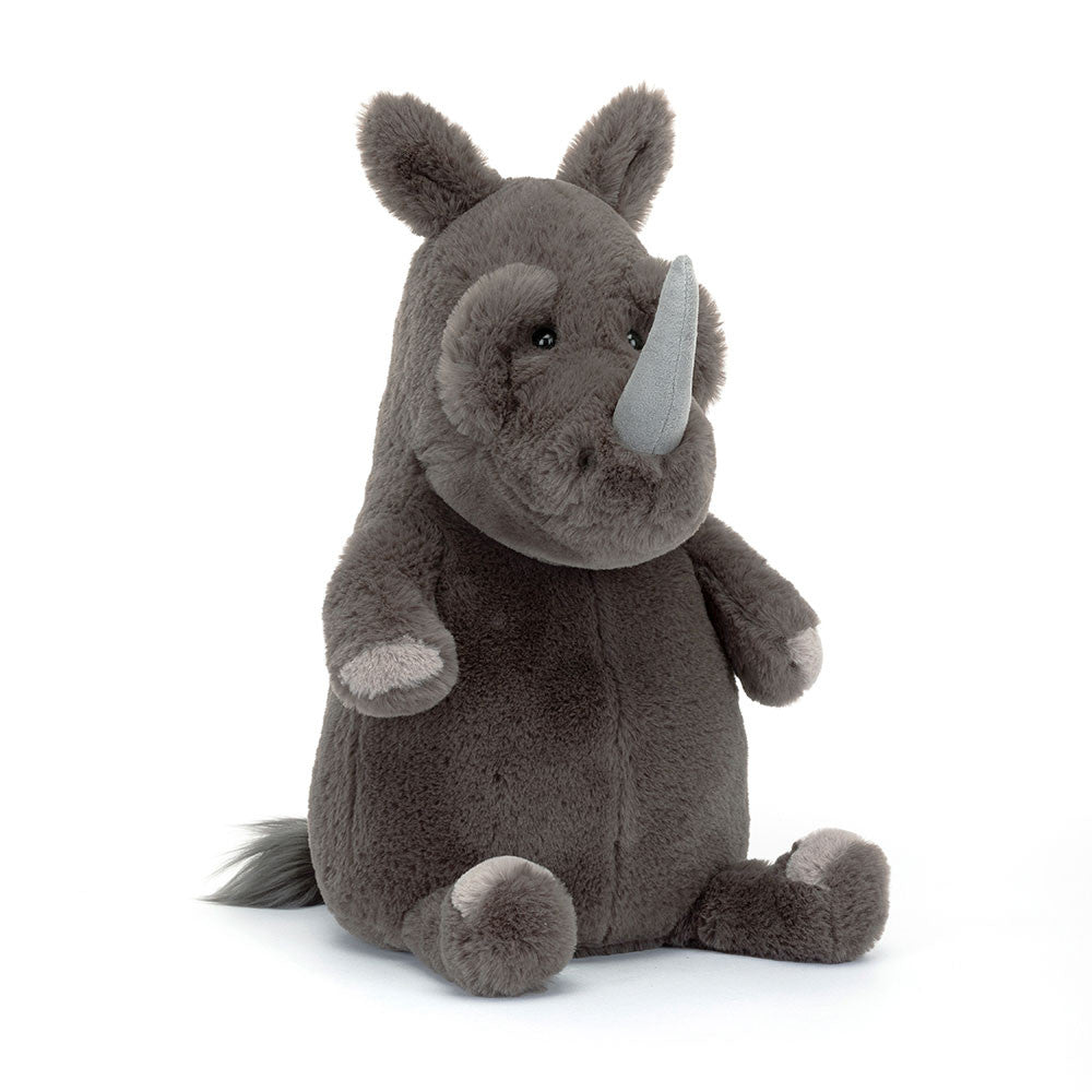 Angled View:  Jellycat Roderick Rhinoceros (37 cm x 15 cm): A cuddly rhino plush with rumpled brow, petal ears, big horn, and textured grey fur. Perfect for playtime and cuddles!