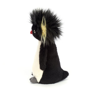 Side: Check out Ronnie's funky style! This Jellycat penguin boasts a spiky black and yellow mane and a soft black and white body.