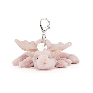 Front-facing view of Jellycat Rose Dragon Bag Charm, highlighting its soft pink fur, sparkly wings, and friendly expression.