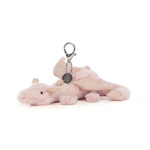 Jellycat Rose Dragon Bag Charm with pink fur, silver glitter accents, and claw clip, shown at an angle.