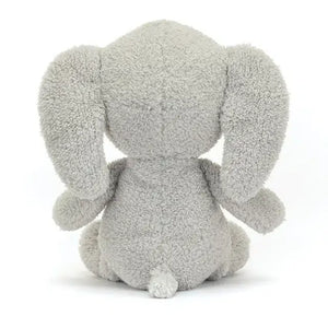 Back view of Jellycat Rumblikin Elly highlighting its fluffy tail and smooth plush texture.