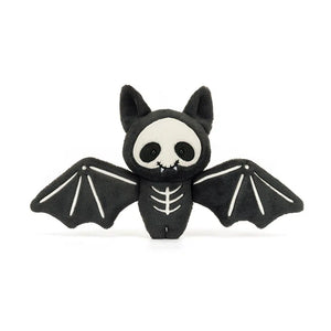 Straight: Huggable Jellycat Skelebat Jim plush (front view) with suedette skull & fold ears. Unique Halloween soft toy..