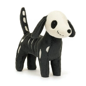 Angled: Jellycat Skeledog Dan plush (angled view) with cream suedette ribs & floppy ears.