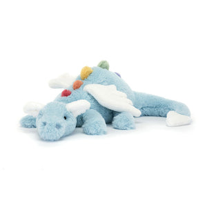 Angled View: Soar through playtime! The Jellycat Sky Dragon dips a wing, showcasing its long sky-blue body with rainbow plush spines, a cuddly snout with bobble nostrils, and cloud-white wings, ears, and tail dart. A dreamy friend for adventures!