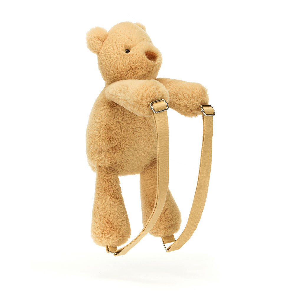 Jellycat Smudge Bear Backpack standing upright with adjustable beige straps visible.