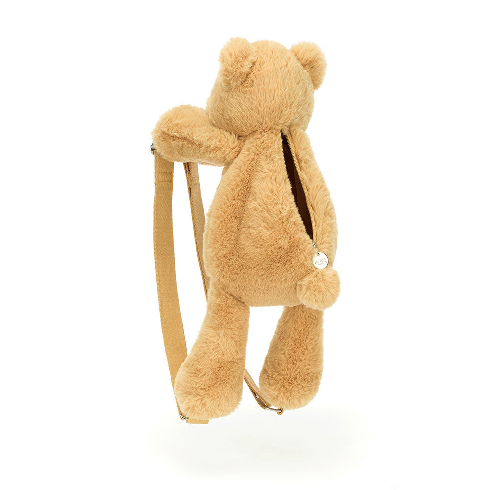 Angled view of Jellycat Smudge Bear Backpack showing zipped tummy compartment and straps.