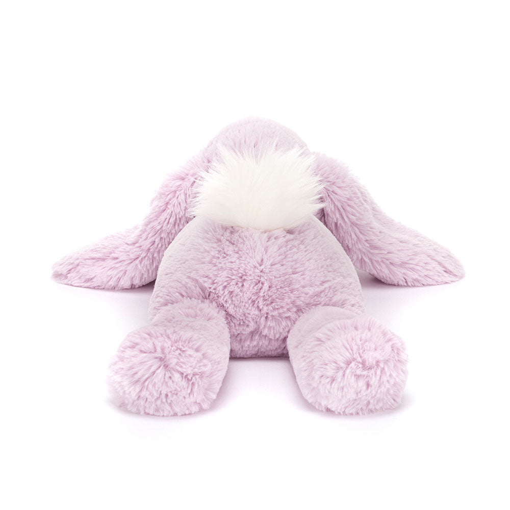 Back view of Jellycat Smudge Lavender Rabbit, featuring its fluffy tail and soft, plush texture.