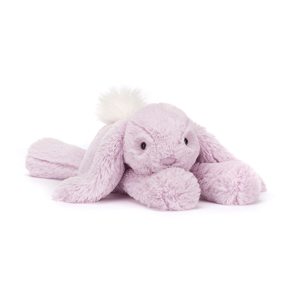 Angled view of Jellycat Smudge Lavender Rabbit, highlighting its long, floppy ears and cuddly design.