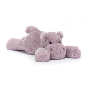 Jellycat Smudge Hippo laying stretched out, highlighting its wide, soft lilac fur, dainty ears, and curved tail.