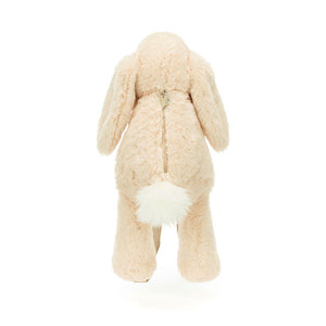 Backside of the Jellycat Smudge Rabbit Backpack showcasing  a cute snowy bobtail