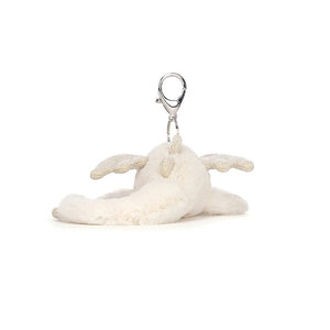 A rear view of Jellycat Snow Dragon Bag Charm showing a long tail.